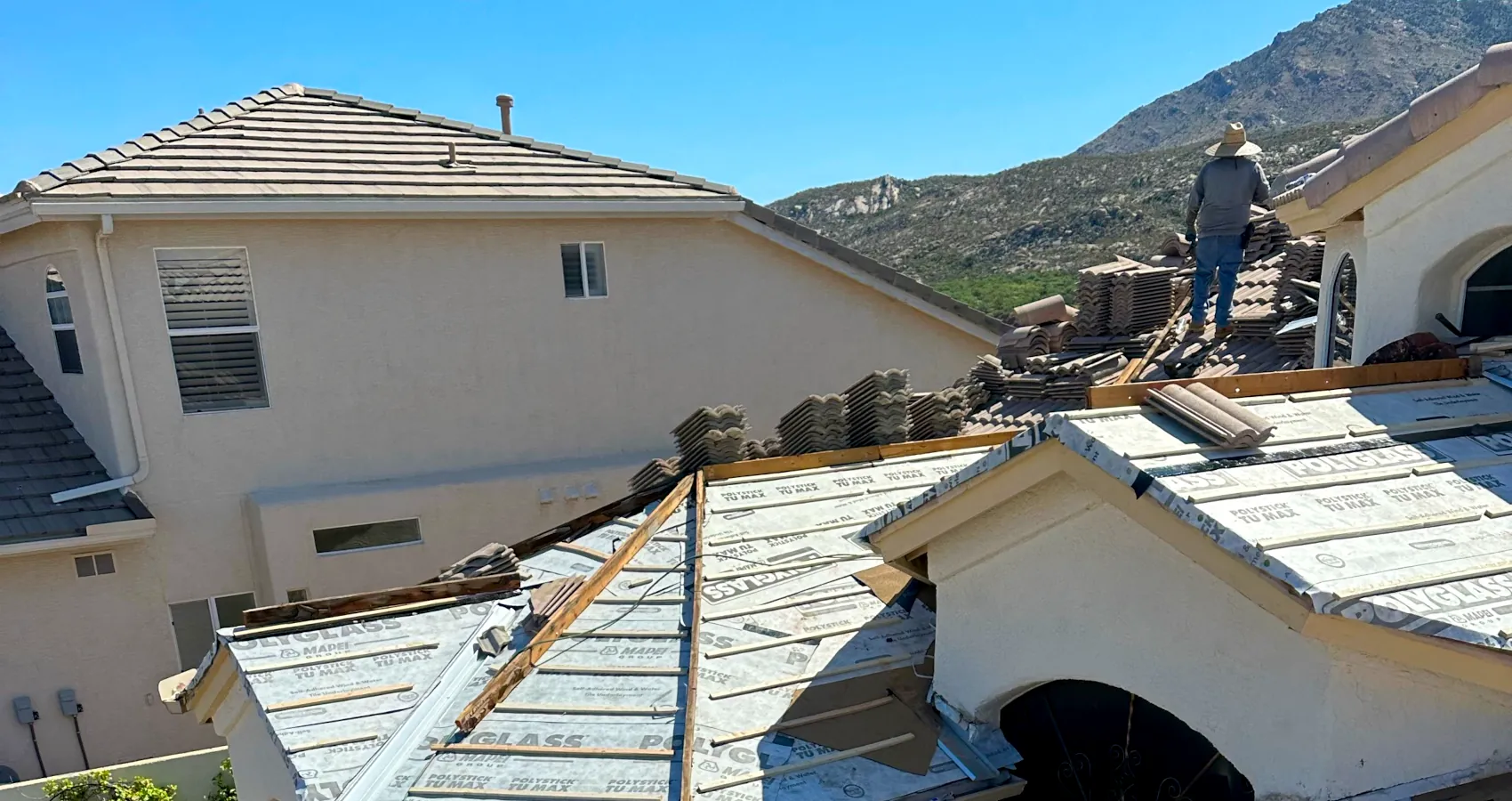Roofer installing a new roof in Tucson